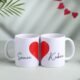Custom couple photo mugs with heart-shaped handles printed using sublimation, ideal for wedding and anniversary gifts in Ahmedabad Gujarat