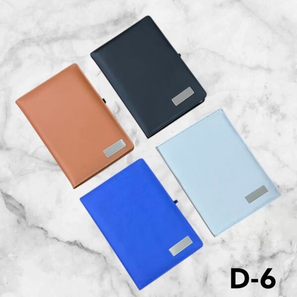Premium leather finish corporate notebook with customizable metal logo plate available in blue, grey and brown for branding in Ahmedabad