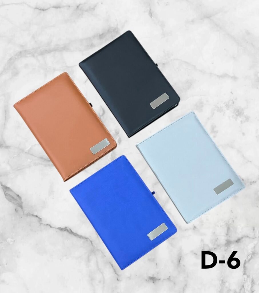 Premium leather finish corporate notebook with customizable metal logo plate available in blue, grey and brown for branding in Ahmedabad